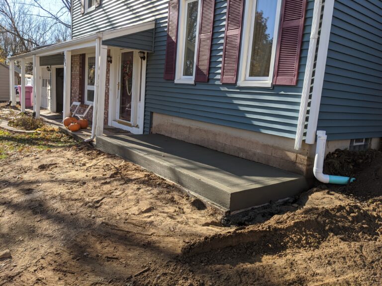 Concrete front stoop and entry walkway
