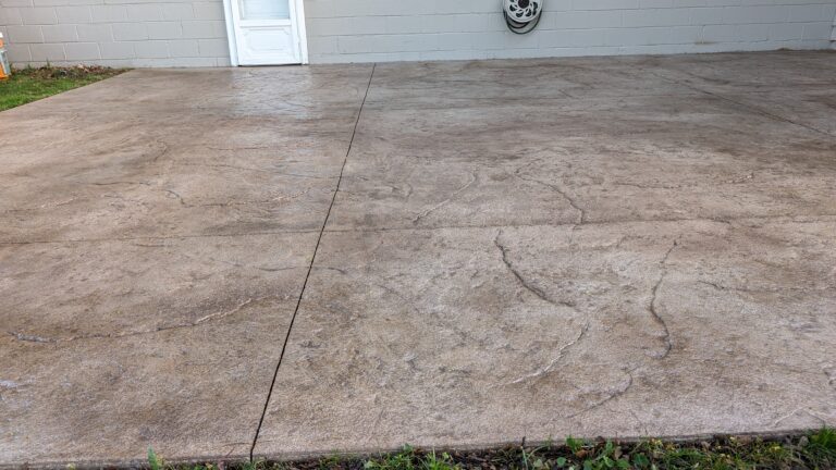 Wide view of finished stamped concrete patio with stone pattern