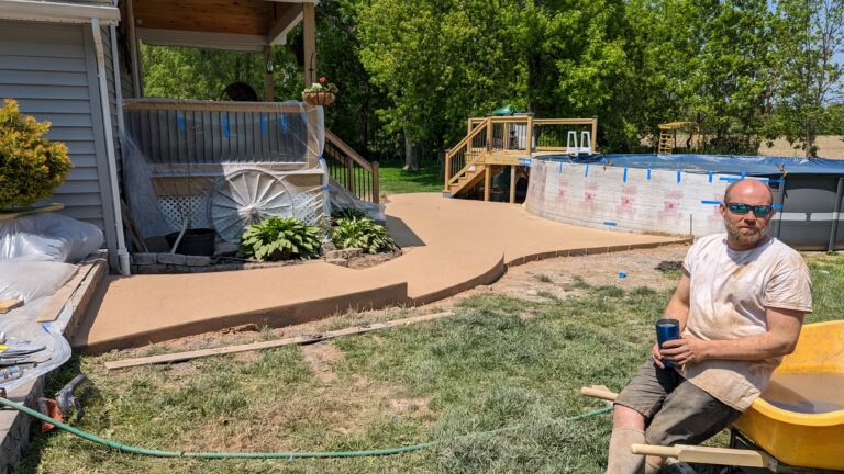 Colored concrete walkway and pool surround