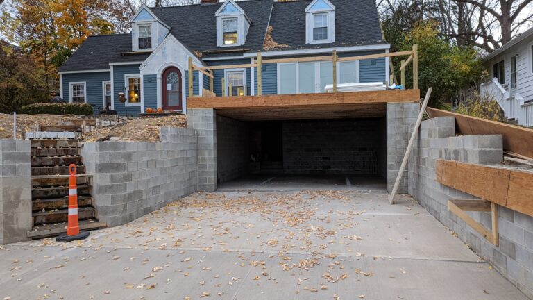 Concrete driveway, block foundation, and garage floor