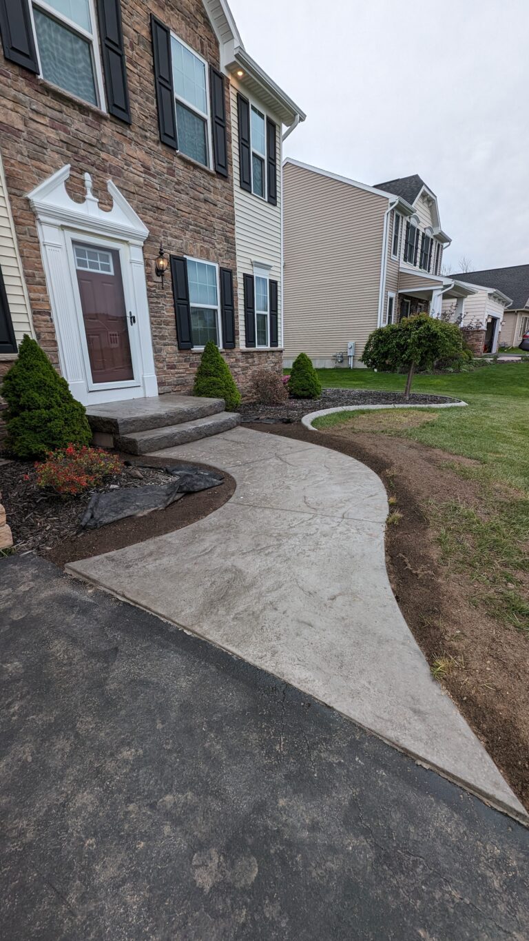 Curvy stamped concrete steps and walkway side view