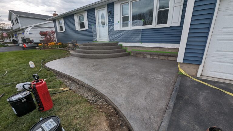 Curvy stamped concrete walkway and stoop