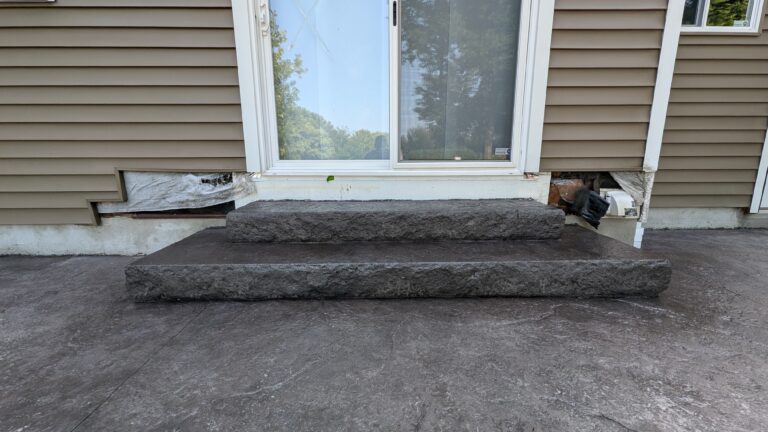 Stamped concrete steps leading to patio