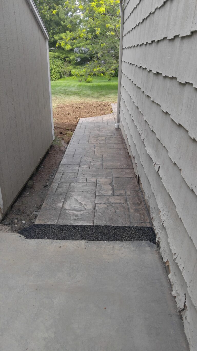 Stamped concrete retaining wall and patio