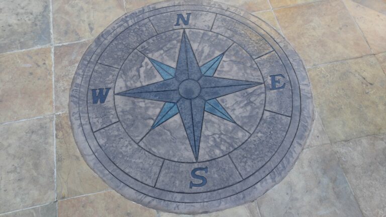 Decorative compass rose stamped concrete detail