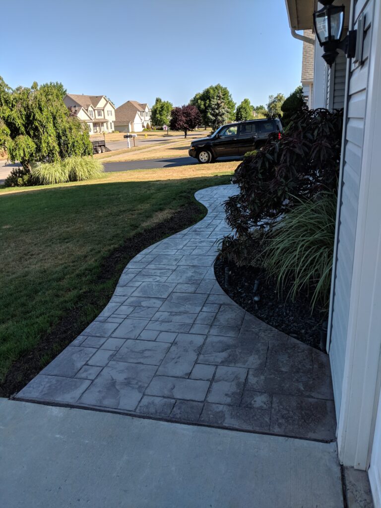 Curved stamped concrete walkway
