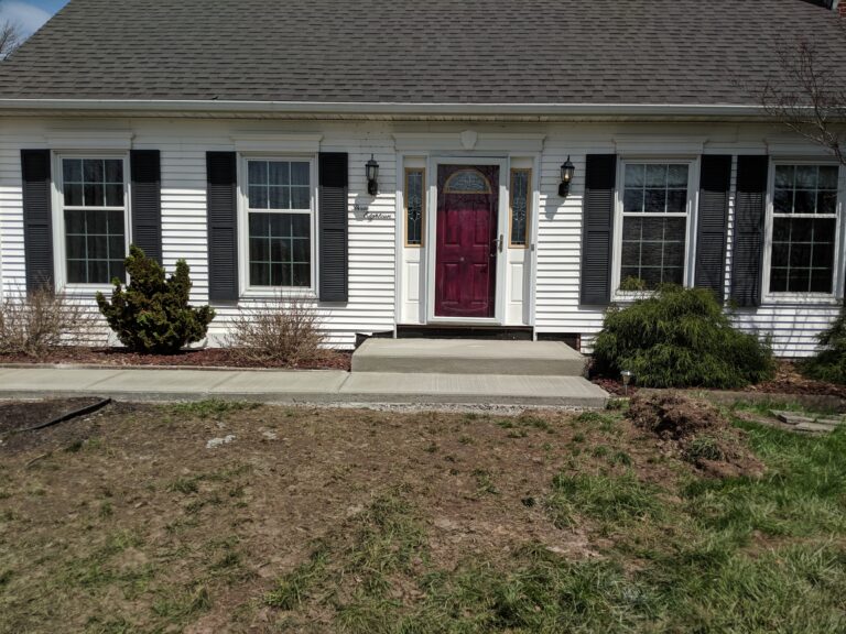 Concrete front stoop and walkway
