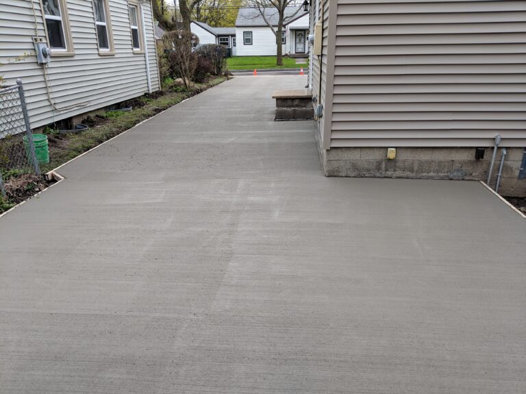 Side driveway concrete pour between houses