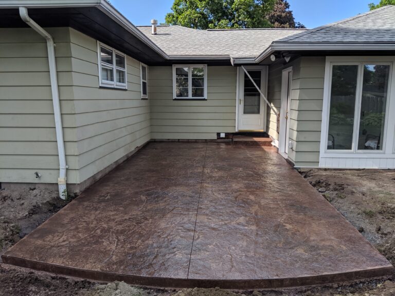 Stamped concrete patio in brown tones - wide view