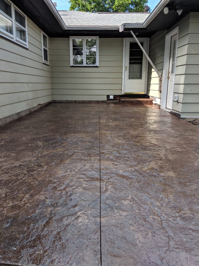 Stamped concrete patio in brown tones - close view