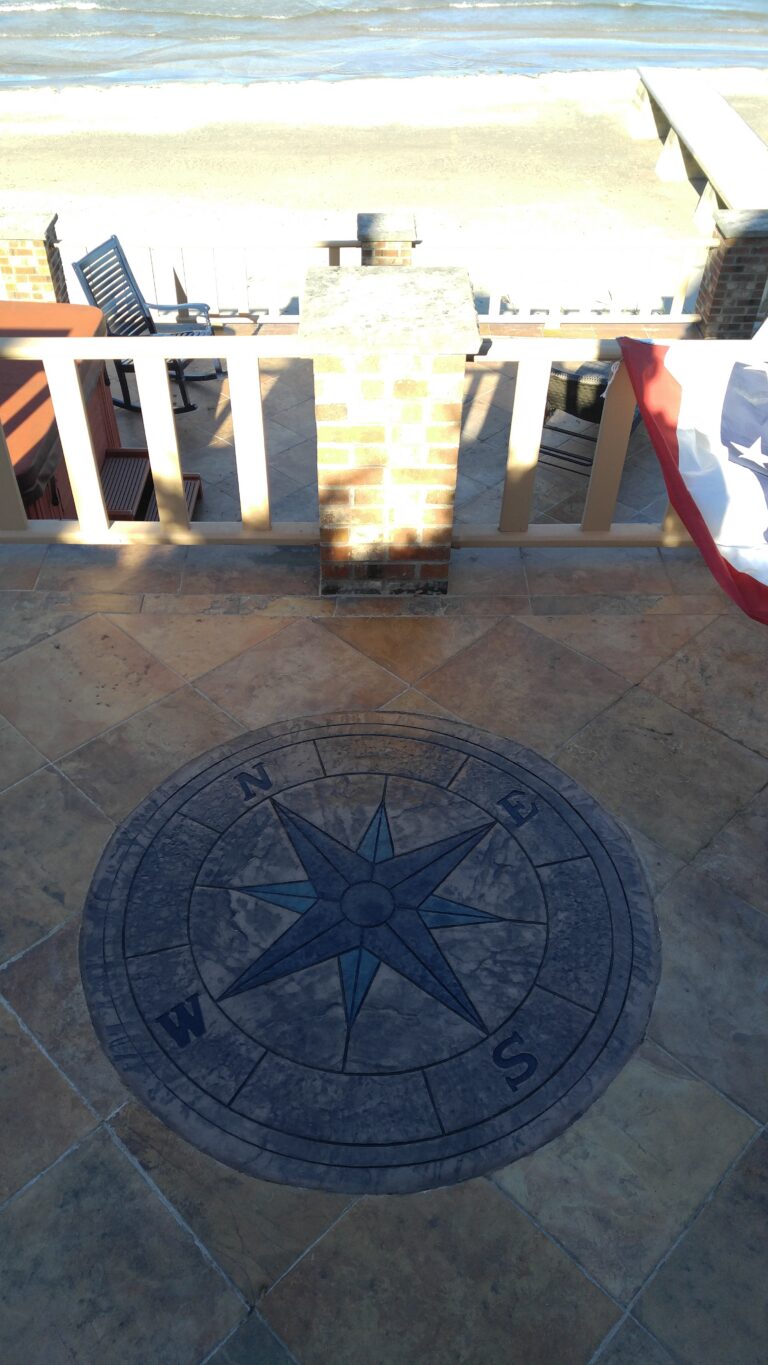 Stamped concrete pool deck with compass rose medallion inlay and flagstone pattern – Rochester NY