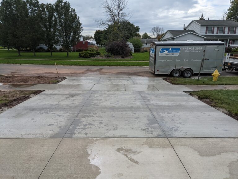 New concrete driveway apron replacement with Re-Crete trailer on site in Rochester, NY