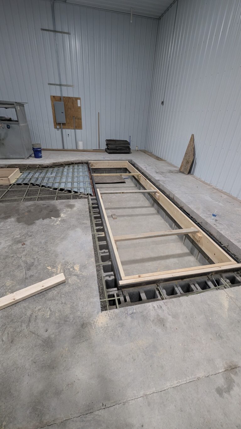ICF block and wood formwork for in-ground concrete pit foundation inside commercial steel building – Rochester NY