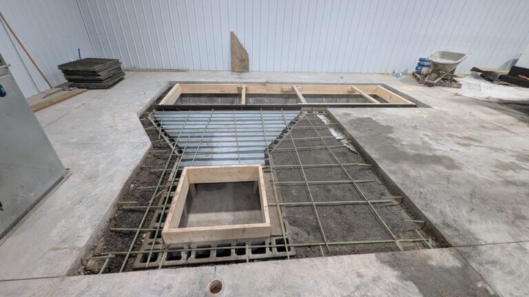 Aerial view of rebar grid and ICF block formwork for multi-opening commercial pit foundation – Rochester NY