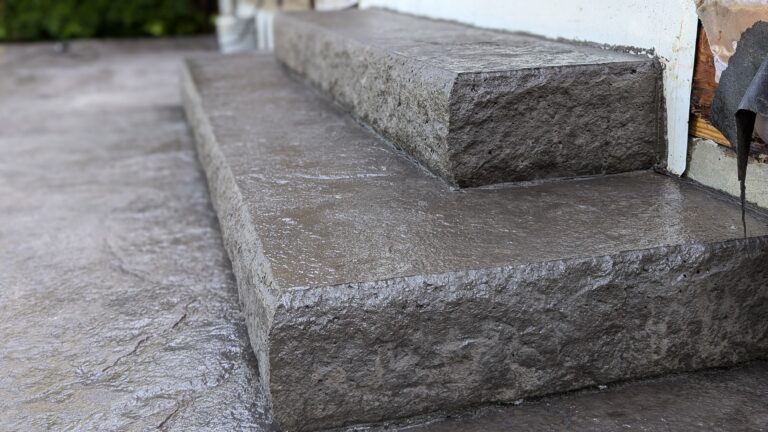 Macro close-up of chiseled stone face texture on stamped concrete step riser – Rochester NY